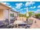 Outdoor patio with cozy seating, a table, and a covered area for relaxing at 16246 W Talara Way, Surprise, AZ 85374