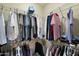 Organized walk-in closet with metal shelving, clothing racks, and ample storage space for shoes and accessories at 16246 W Talara Way, Surprise, AZ 85374