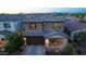 Stunning aerial view of a home with a large backyard, lush landscaping, and a private driveway at 17424 W Willow Ave, Surprise, AZ 85388