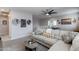 Cozy living room features a comfortable sofa and nearby recreation room for entertaining at 17424 W Willow Ave, Surprise, AZ 85388