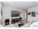 Inviting living room features a large TV and plenty of seating for guests at 17424 W Willow Ave, Surprise, AZ 85388