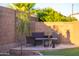 Cozy patio area with comfortable seating and a charming fire pit for relaxing evenings outdoors at 17424 W Willow Ave, Surprise, AZ 85388