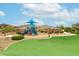 Community playground offering a fun and safe area for children to play, with colorful equipment and a grassy area at 17424 W Willow Ave, Surprise, AZ 85388