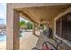 Covered patio provides shade and comfort while overlooking the backyard pool at 18249 W Mauna Loa Ln, Surprise, AZ 85388
