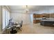 Stylish kitchenette features stainless appliances, a black island and wood cabinets at 18249 W Mauna Loa Ln, Surprise, AZ 85388