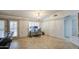 Bright office space with tile flooring, a window with shutters, and a stylish chandelier at 18249 W Mauna Loa Ln, Surprise, AZ 85388