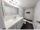 Clean and modern bathroom with a new shower and quartz countertop vanity at 18811 N 19Th Ave # 2020, Phoenix, AZ 85027