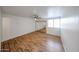 Bright and airy bedroom featuring wood-look flooring, large mirrored closet doors, and neutral paint at 18811 N 19Th Ave # 2020, Phoenix, AZ 85027