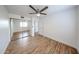 Bedroom featuring wood-look floors, ceiling fan and a mirrored closet at 18811 N 19Th Ave # 2020, Phoenix, AZ 85027