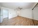 Spacious bedroom with a ceiling fan, wood look floors and large closet at 18811 N 19Th Ave # 2020, Phoenix, AZ 85027