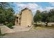 Exterior side-view of a well-maintained condo building with lush green spaces at 18811 N 19Th Ave # 2020, Phoenix, AZ 85027