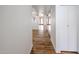 Hallway with wood look floors leading to living room and closet at 18811 N 19Th Ave # 2020, Phoenix, AZ 85027