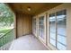 Cozy balcony featuring double glass doors and a storage unit, perfect for outdoor living at 18811 N 19Th Ave # 2020, Phoenix, AZ 85027