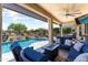 Inviting backyard retreat with pool, covered patio and outdoor seating area at 20655 N 273Rd Ave, Buckeye, AZ 85396