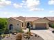Charming single-story home with desert landscaping and a welcoming entrance at 20655 N 273Rd Ave, Buckeye, AZ 85396