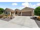 Beautiful single-story home with a desert-landscaped front yard, tile roof, and attached garage; great curb appeal at 20655 N 273Rd Ave, Buckeye, AZ 85396