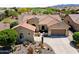 Beautiful single-Gathering home featuring desert landscaping and a tile roof in a golf course community at 20655 N 273Rd Ave, Buckeye, AZ 85396