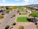 Aerial view of the golf course with homes in the community at 20655 N 273Rd Ave, Buckeye, AZ 85396