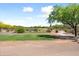 Scenic view of the golf course with lush green fairways and mature trees, offering a peaceful and picturesque setting at 20655 N 273Rd Ave, Buckeye, AZ 85396