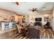 Open living room showcasing hardwood floors and seamlessly connecting the kitchen and dining area at 20655 N 273Rd Ave, Buckeye, AZ 85396