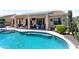 Beautiful pool area featuring a covered patio and lush greenery at 20655 N 273Rd Ave, Buckeye, AZ 85396