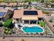 Aerial view of a single Gathering home with a covered patio, pool, solar panels and desert landscaping at 20655 N 273Rd Ave, Buckeye, AZ 85396