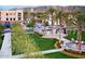 Beautiful community green space with palm trees and views of the surrounding mountain at 21612 W Pierson St, Buckeye, AZ 85396