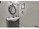 Small bathroom with cabinet sink, decorative mirror, and neutral wall color at 225 N Standage -- # 139, Mesa, AZ 85201