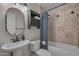 Full bathroom showcasing a vanity sink, tiled shower-tub combination, and a neutral color scheme at 225 N Standage -- # 139, Mesa, AZ 85201