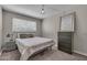 Cozy bedroom featuring a double bed, window blinds, and modern decor at 225 N Standage -- # 139, Mesa, AZ 85201