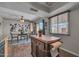 Inviting dining area featuring stylish decor and hardwood floors, illuminated by a ceiling fan and natural light at 225 N Standage -- # 139, Mesa, AZ 85201