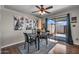 Dining room featuring hardwood floors, a ceiling fan, and sliding glass doors to the backyard at 225 N Standage -- # 139, Mesa, AZ 85201