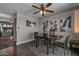 Dining room featuring hardwood floors, a ceiling fan, and decorative wall art at 225 N Standage -- # 139, Mesa, AZ 85201