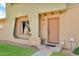 Charming exterior of the home with decorative brick accents and inviting front door at 225 N Standage -- # 139, Mesa, AZ 85201