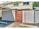 View of the home's exterior with a wooden fence and covered parking area at 225 N Standage -- # 139, Mesa, AZ 85201