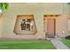 Charming exterior of the home with decorative brick accents and inviting front door at 225 N Standage -- # 139, Mesa, AZ 85201