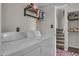Washer and dryer hookups with storage shelf, adjacent to staircase at 225 N Standage -- # 139, Mesa, AZ 85201
