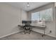 Home office with a modern desk setup, natural lighting and chair at 225 N Standage -- # 139, Mesa, AZ 85201