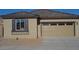 Single-story home featuring a neutral color scheme, two-car garage, and window with dark shutters at 23644 S 209Th Pl, Queen Creek, AZ 85142