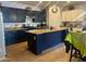 Modern kitchen boasts an island with granite counters, stainless steel appliances, and ample cabinet storage at 23644 S 209Th Pl, Queen Creek, AZ 85142