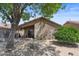 A private backyard featuring a covered patio and desert landscaping at 2467 E Winchester Pl, Chandler, AZ 85286