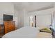 Spacious bedroom with ample natural light, closet space, and carpeted floors at 2467 E Winchester Pl, Chandler, AZ 85286