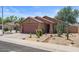 Single-story home with desert landscaping, covered porch, and two-car garage at 2467 E Winchester Pl, Chandler, AZ 85286