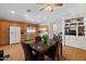 Open concept kitchen features a dining table, laminate floors, and a white refrigerator at 2467 E Winchester Pl, Chandler, AZ 85286