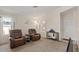 Inviting living room featuring plush seating, neutral carpet and natural light at 2467 E Winchester Pl, Chandler, AZ 85286