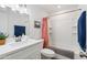 Bathroom is fully equipped with shower and bath with single sink and counter at 2528 N 22Nd Dr, Phoenix, AZ 85009