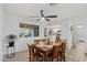Cozy dining room with vintage table set and bright lighting, connecting seamlessly to the living area at 2528 N 22Nd Dr, Phoenix, AZ 85009