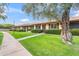 Street view of a row of well-kept homes, each with green lawns and manicured bushes at 2528 N 22Nd Dr, Phoenix, AZ 85009