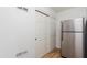 Hallway area shows stainless steel refrigerator and access to closet and other rooms at 2528 N 22Nd Dr, Phoenix, AZ 85009