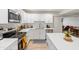 Bright kitchen boasts white cabinetry, stainless steel appliances, and elegant countertops at 2528 N 22Nd Dr, Phoenix, AZ 85009